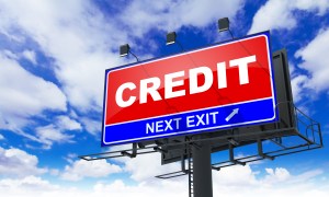 Credit Inscription on Red Billboard.