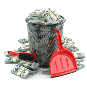 Packs of dollar in the garbage can. Waste of money or currency collapse concept. 3d