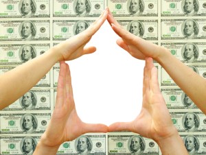 House made of woman hands isolated on dollars background