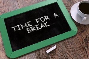 Time for a Break Handwritten by White Chalk on a Blackboard. Composition with Small Green Chalkboard and Cup of Coffee. Top View. 3D Render.
